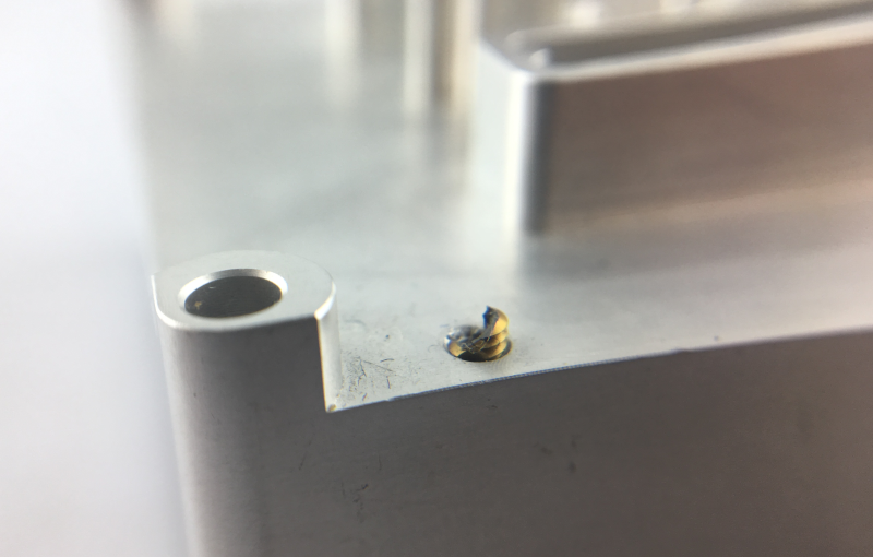 the tapping breaks in M2 blind hole of the aluminum alloy component.